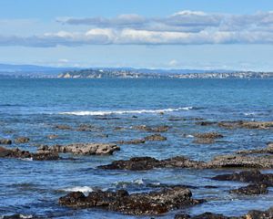 A view of the bay with a city in the background.